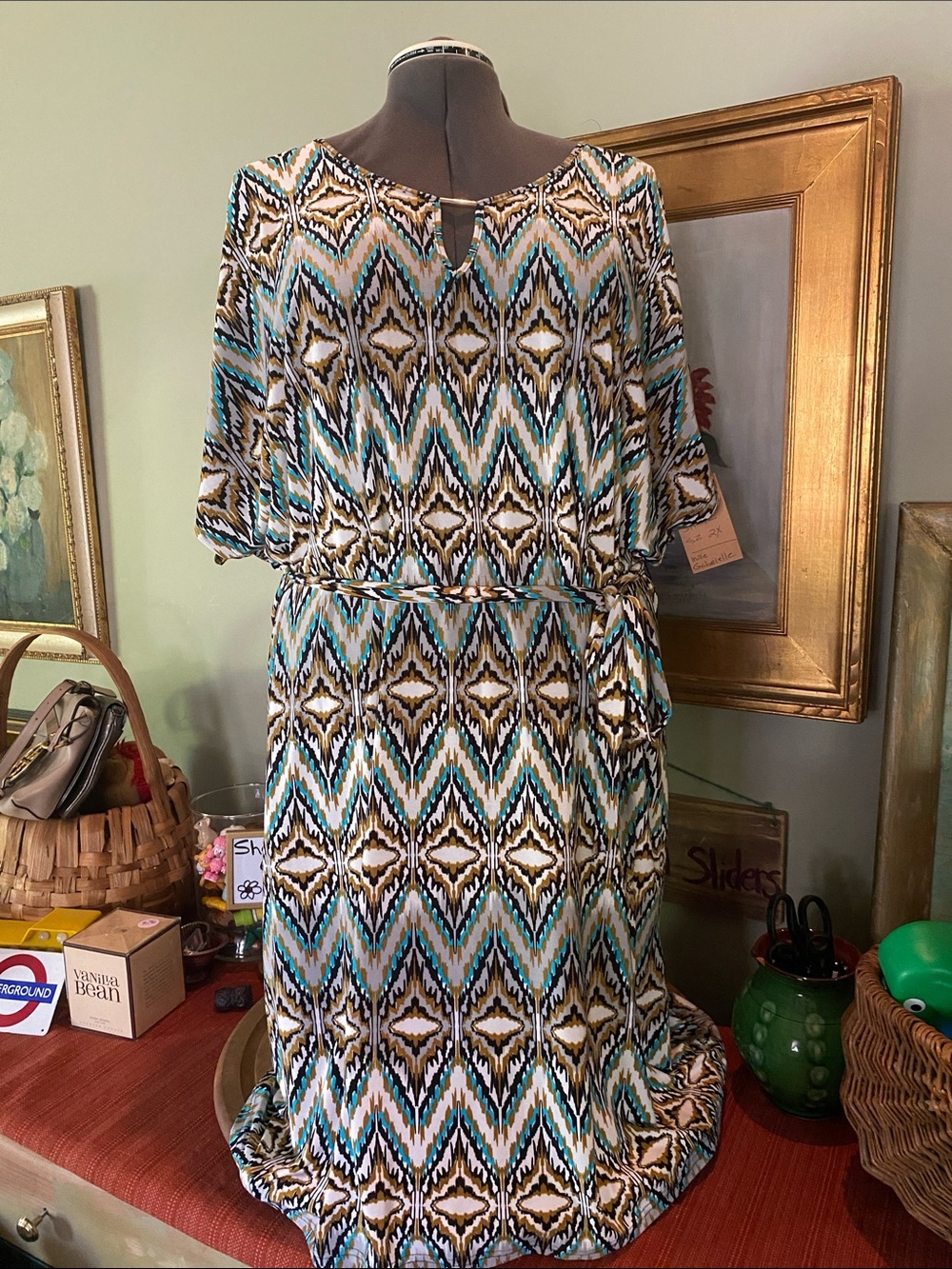 Mlle Gabriel belted chevron print shift dress in gold, white, black, and blue.